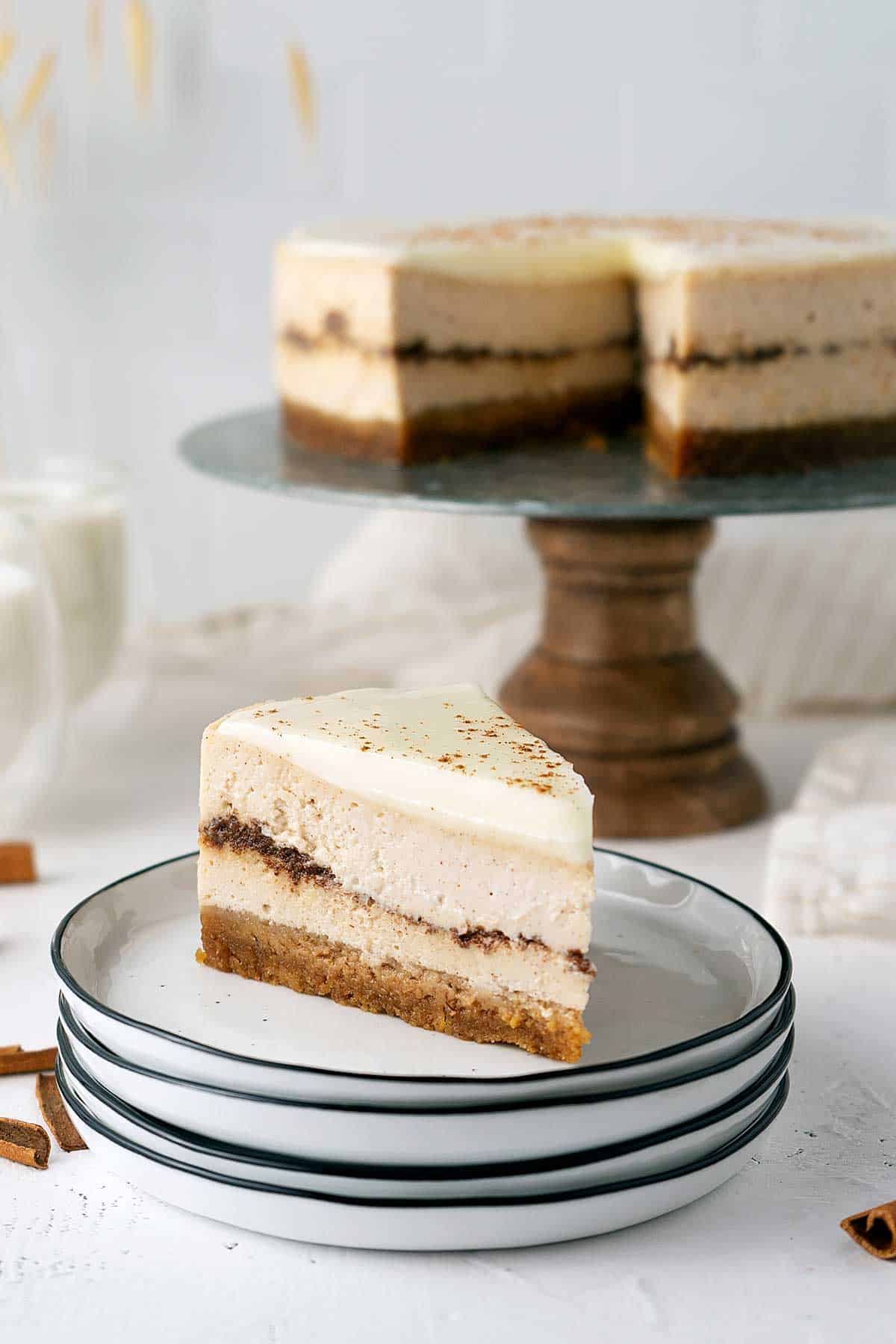 portion of cheesecake on a stack of plates.