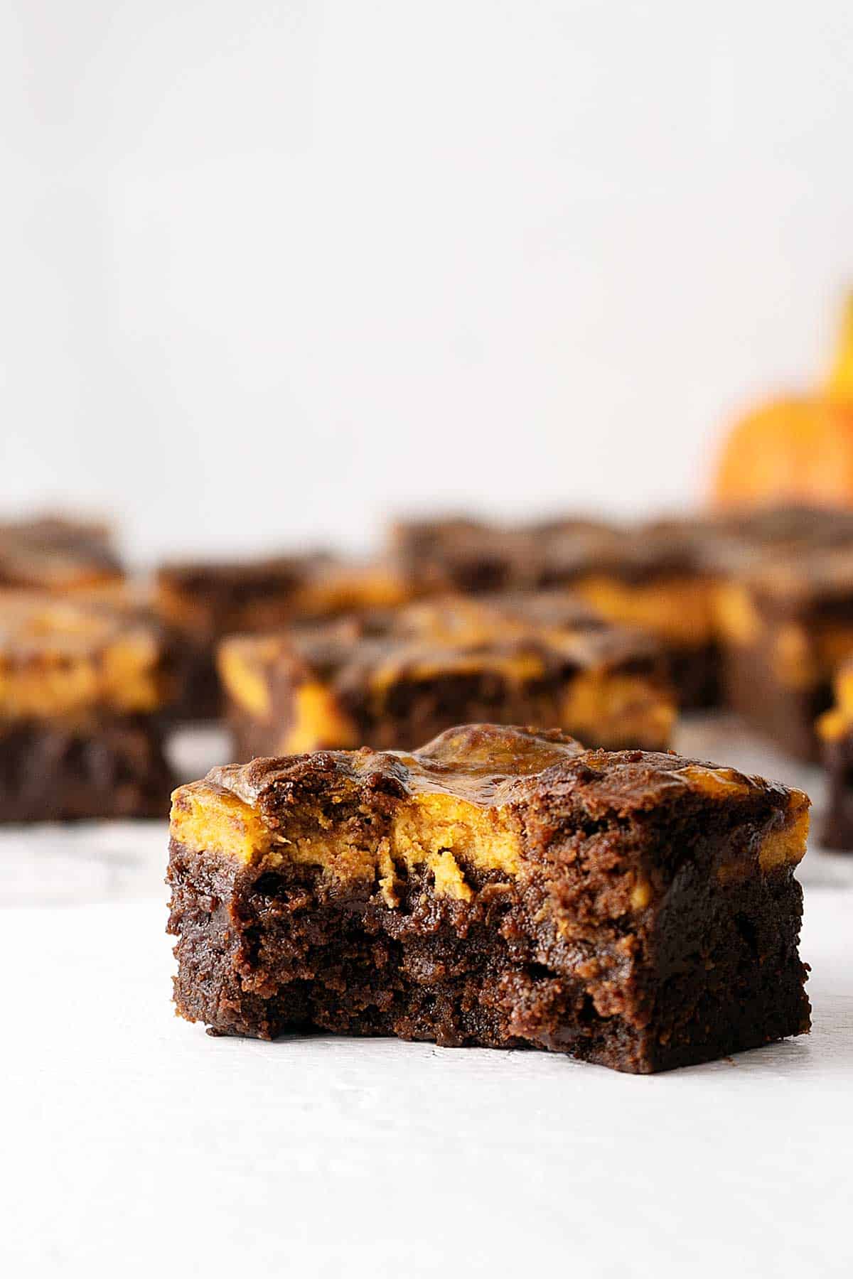 bitten pumpkin cheesecake brownie.