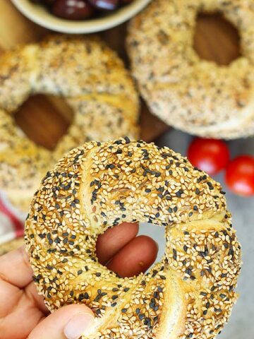 Holding Turkish Sesame Bread Simit