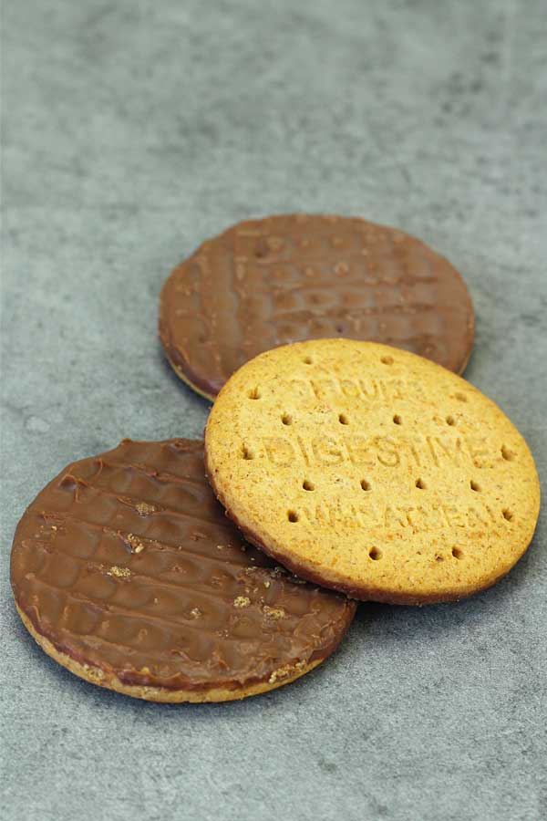 3 chocolate digestive biscuits on a table