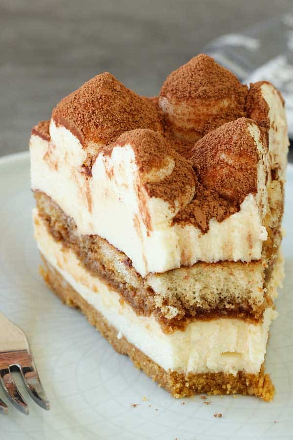 No bake tiramisu cheesecake portion missing a bite