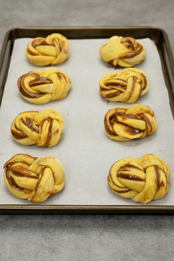 Raw Nutella babka buns on a tray ready to be baked