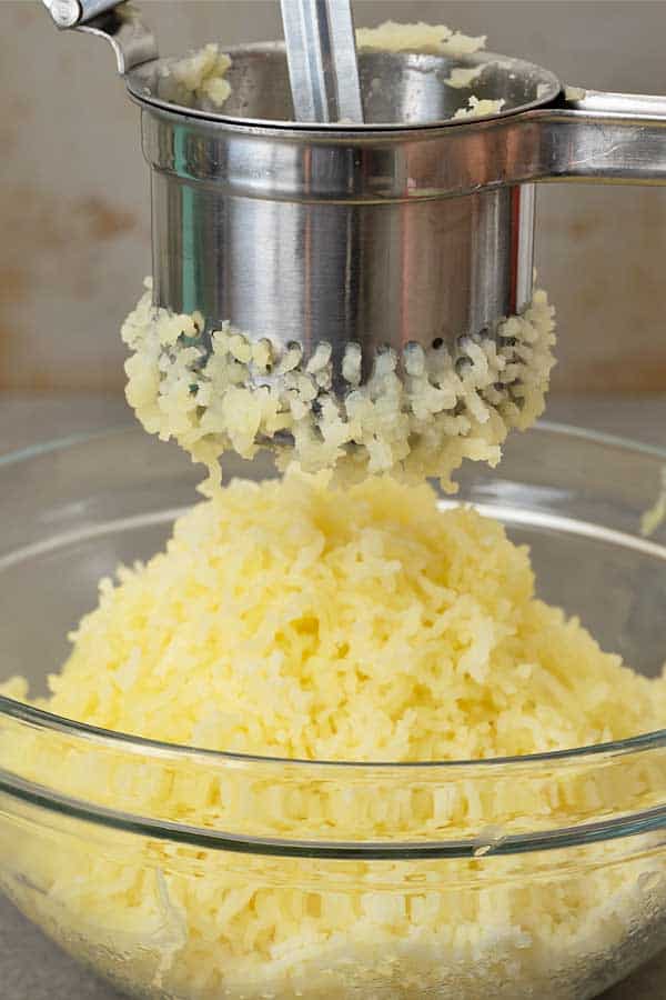 Ricing the potatoes