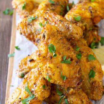 lemon pepper chicken wings served on a table