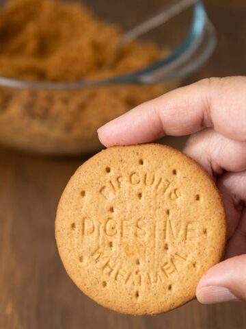 holding a digestive biscuit