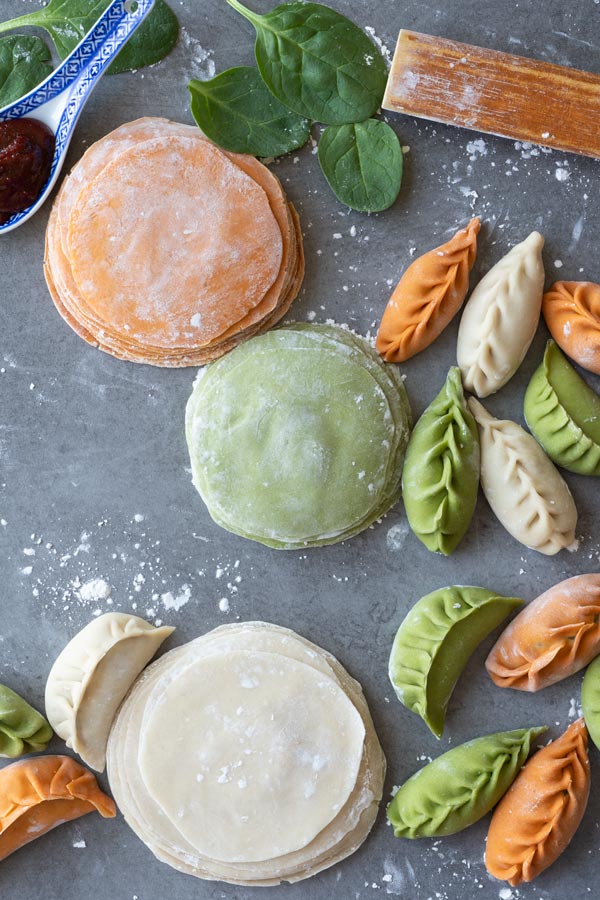 Colourful dumpling wrappers on a table