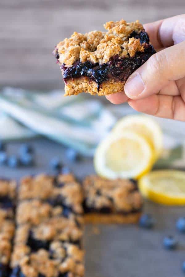 holding a coconut blueberry bar