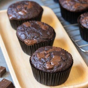 3 Chocolate Banana Muffins on a serving board