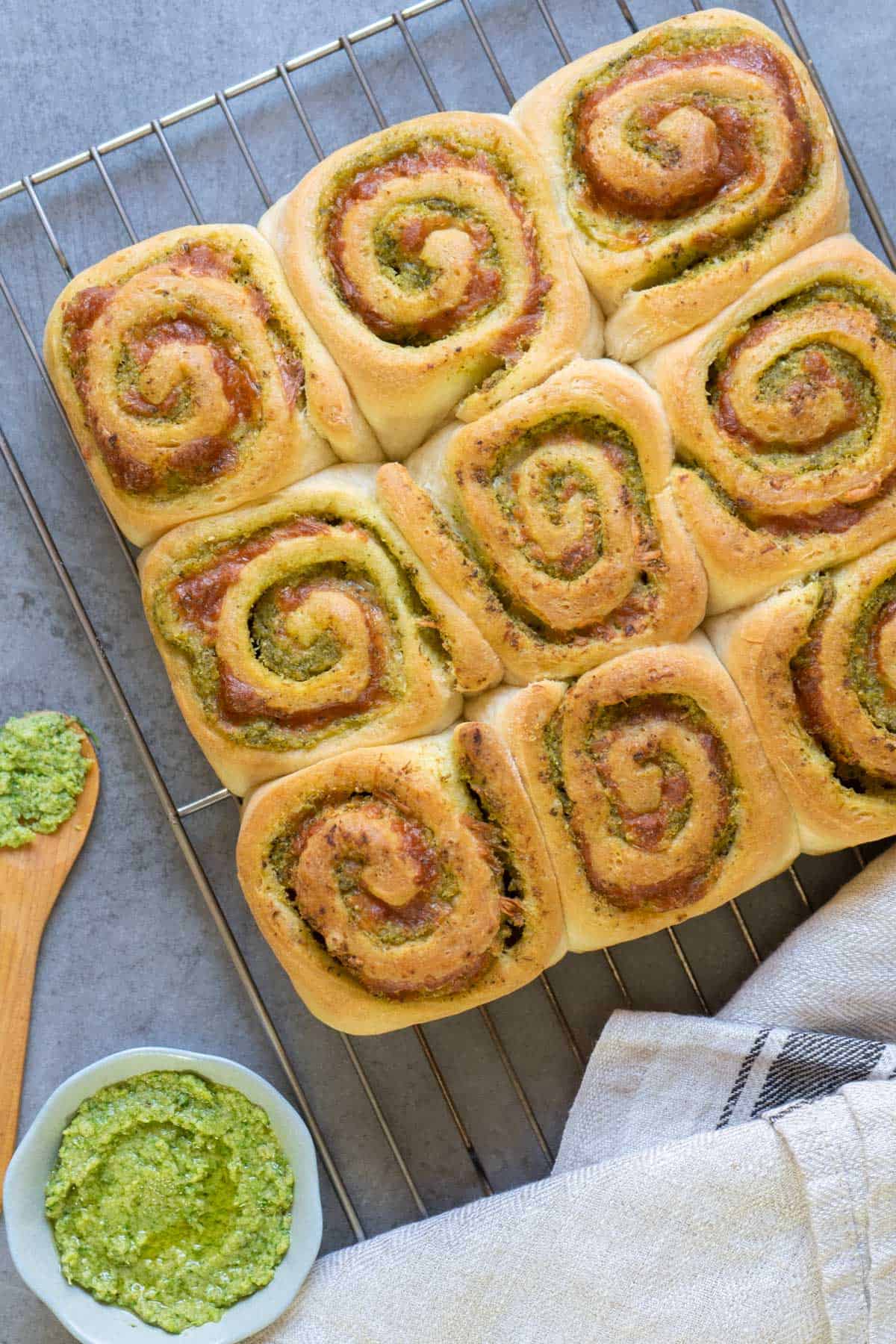 Pesto buns on a cooling rack