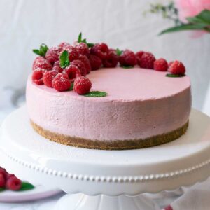 No-Bake Raspberry Cheesecake on a stand plate
