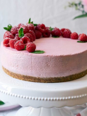 No-Bake Raspberry Cheesecake on a stand plate