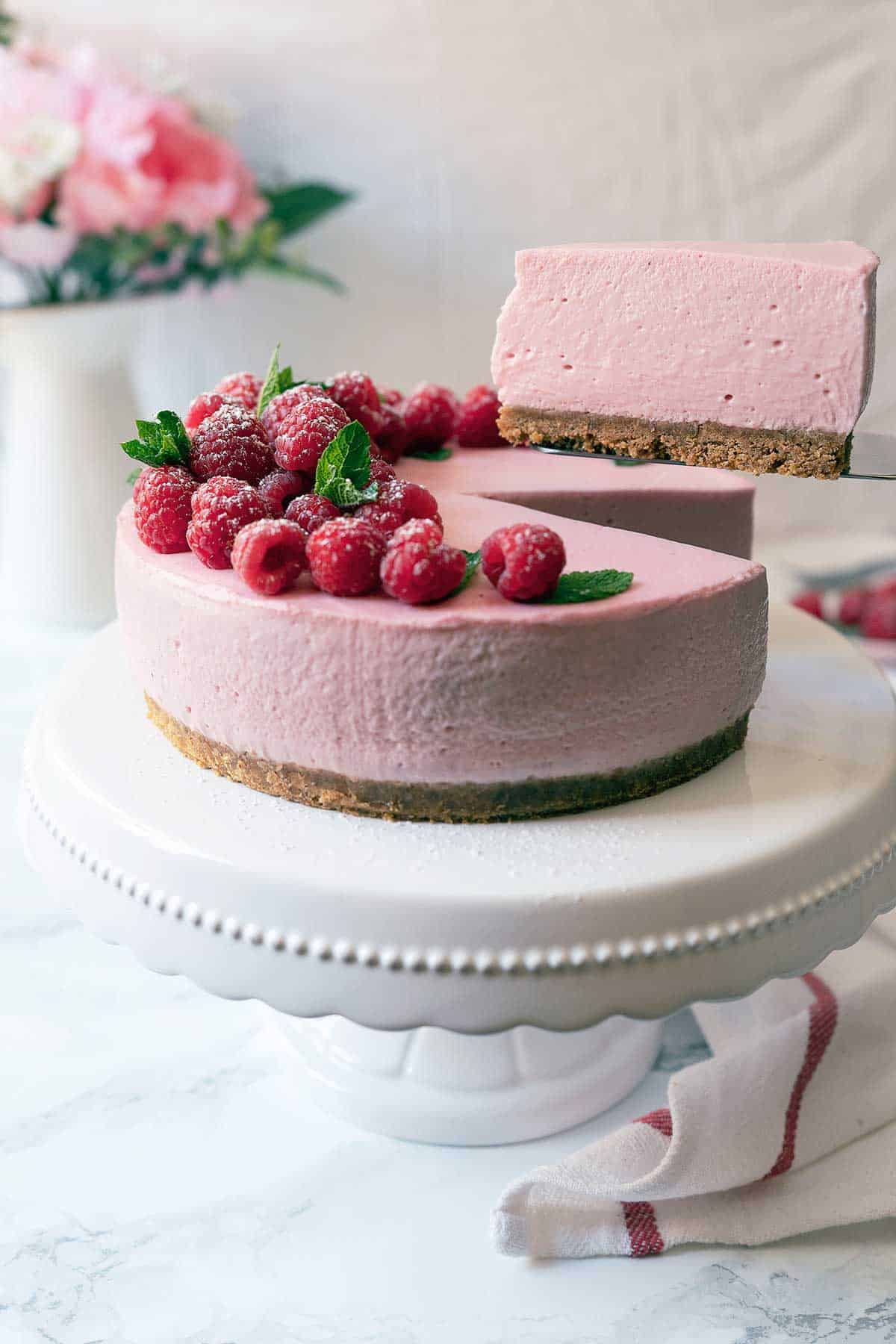 Serving a portion of no-bake raspberry cheesecake