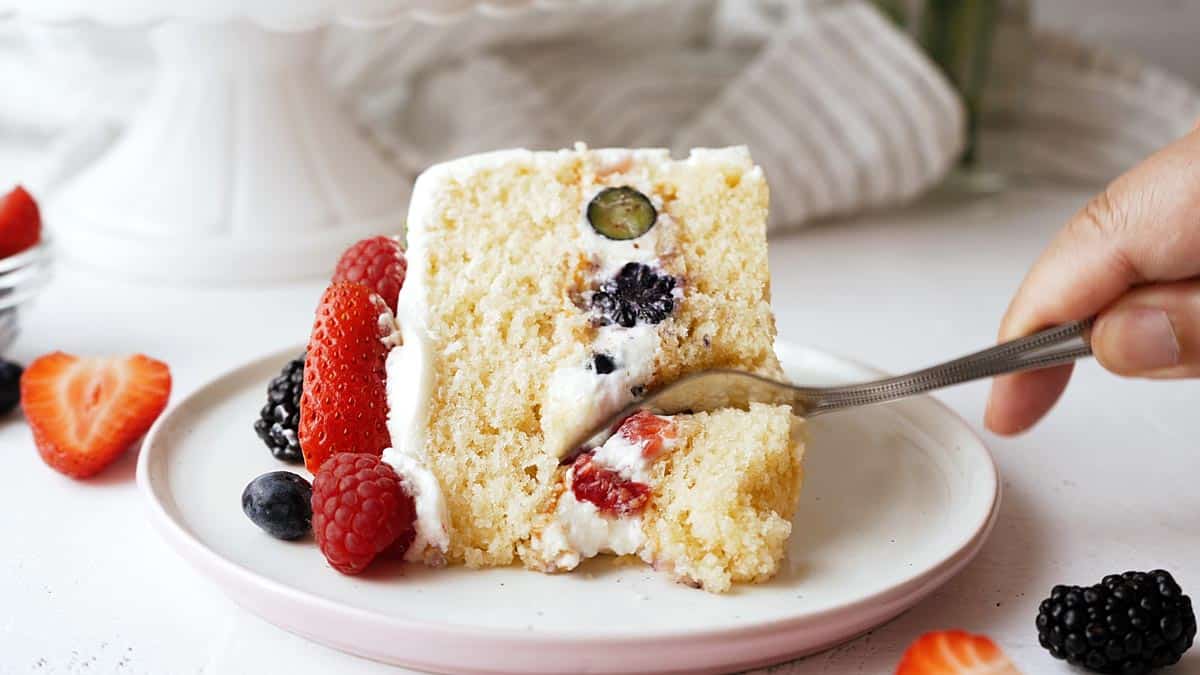 berry cake filled with cream cheese frosting