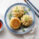 Pan-fried meat buns on a plate