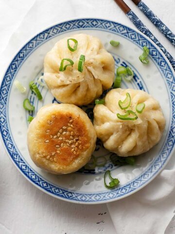 Pan-fried meat buns on a plate