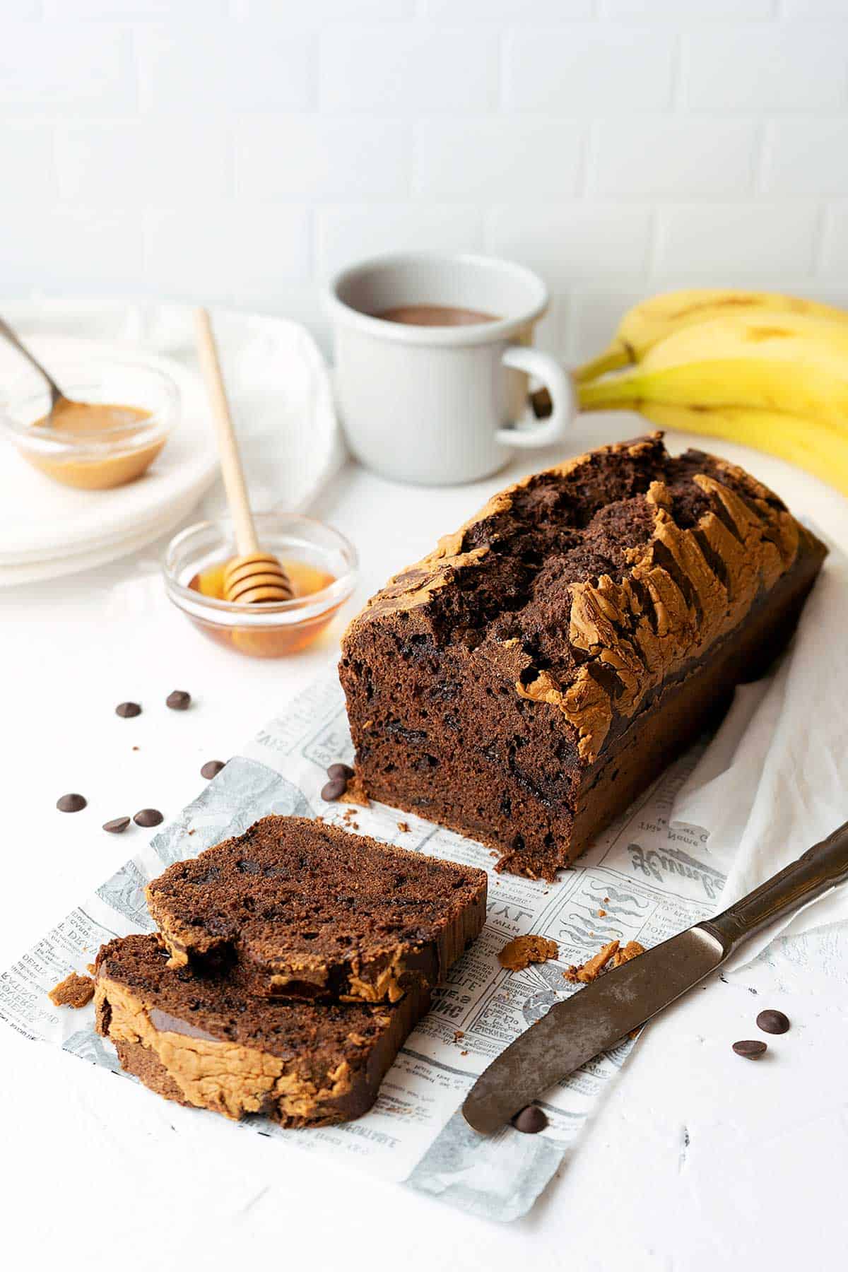 a cut chocolate banana bread loaf