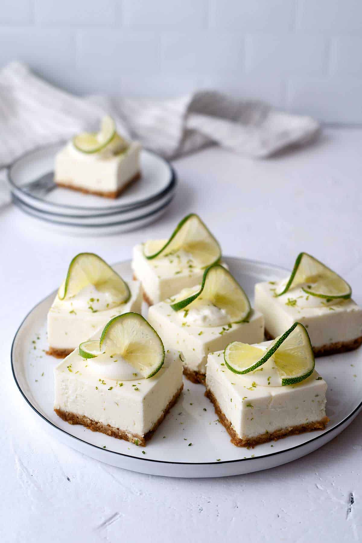 Key lime cheesecake bars served on a plate