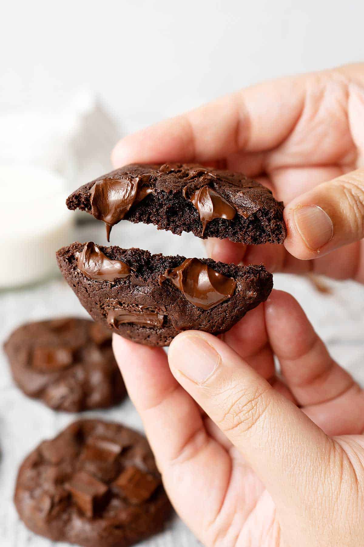 breaking a double chocolate fudge cookie