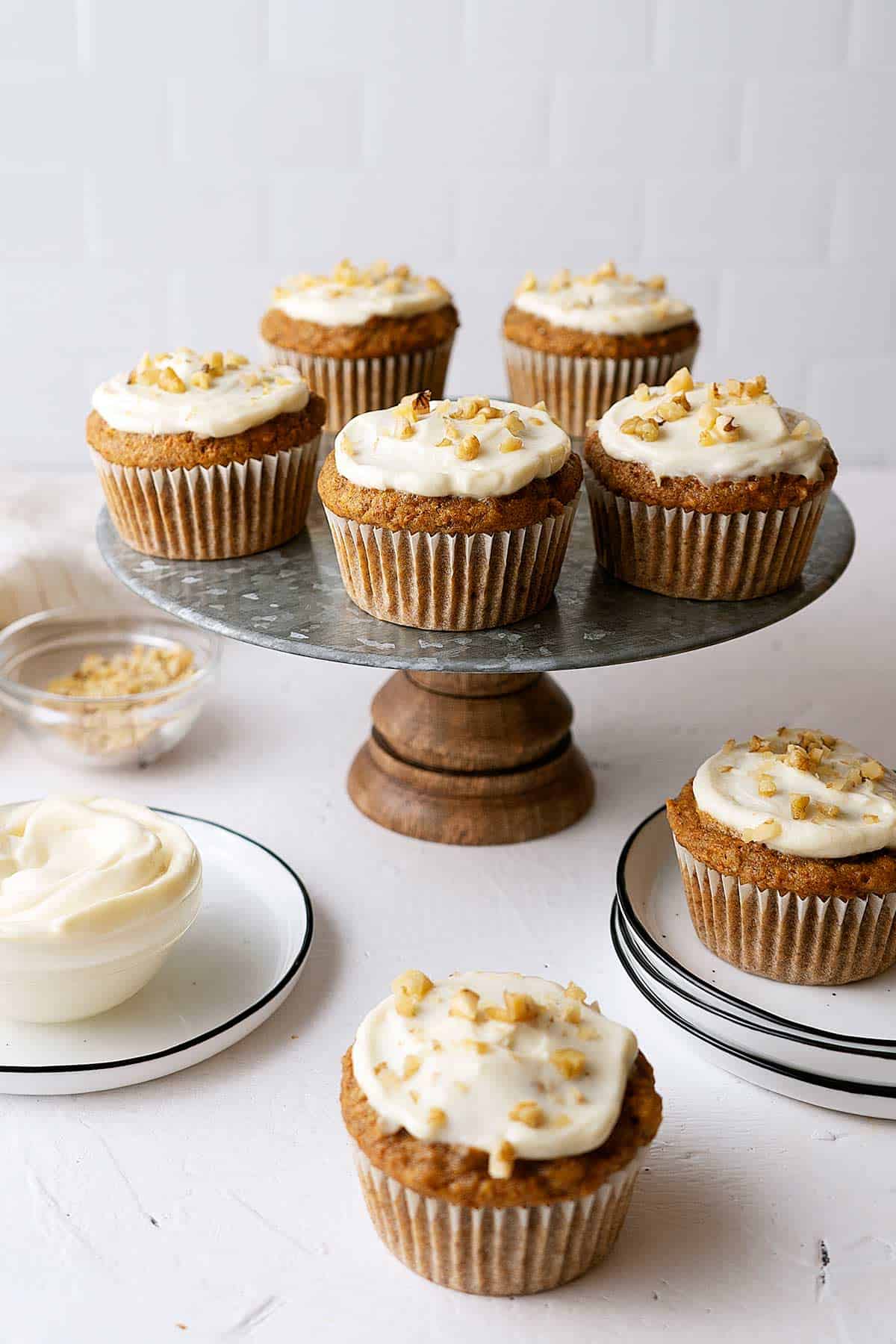 healthy carrot muffins on a stand and table