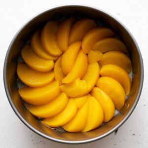 layer of peaches in a springform pan