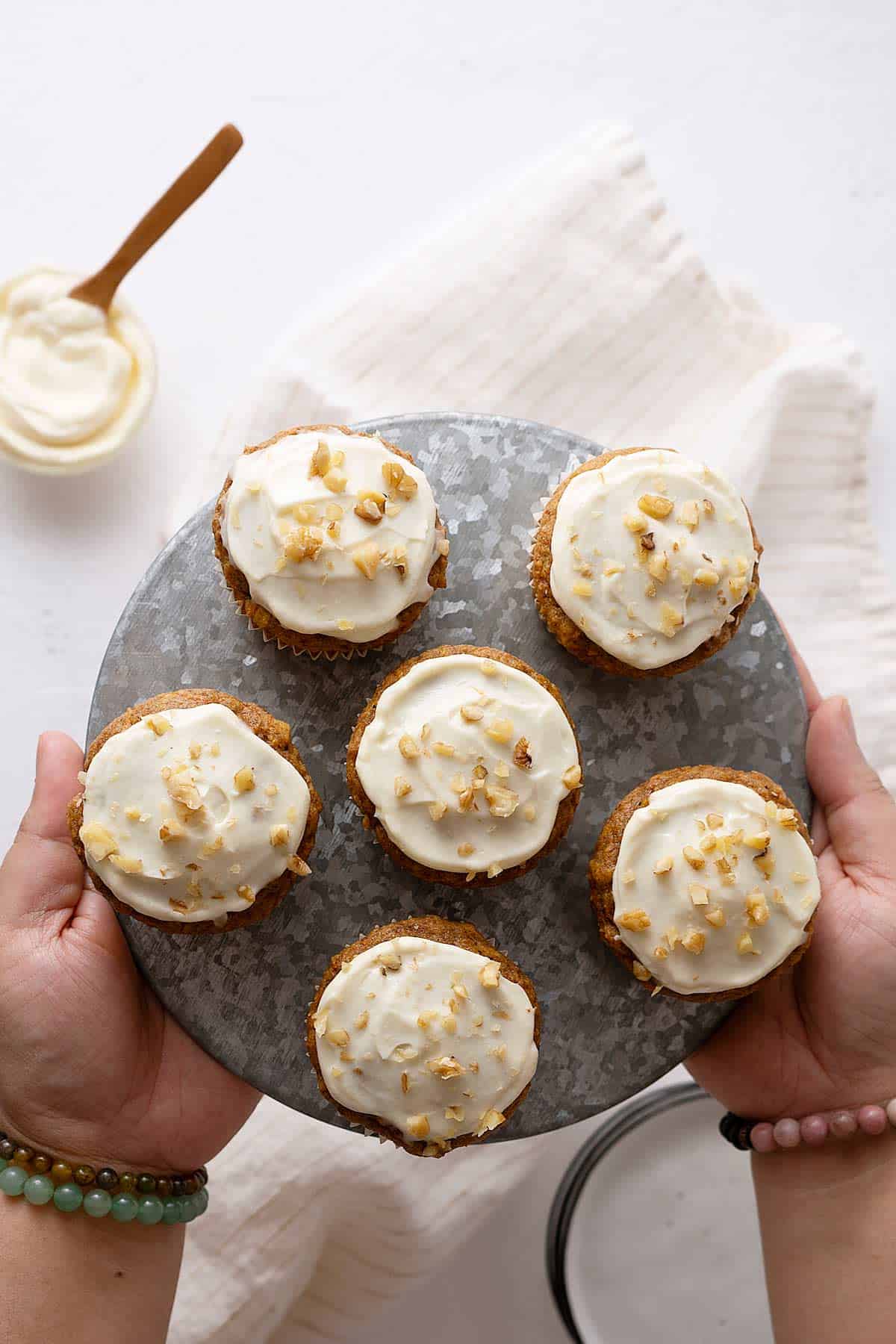 serving a plate with healthy carrot cake muffins