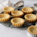 tart shells on a cooling rack