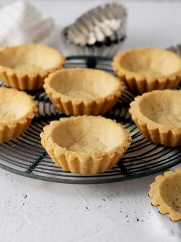 tart shells on a cooling rack