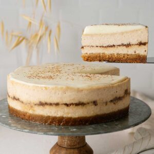 serving cinnamon roll cheesecake.