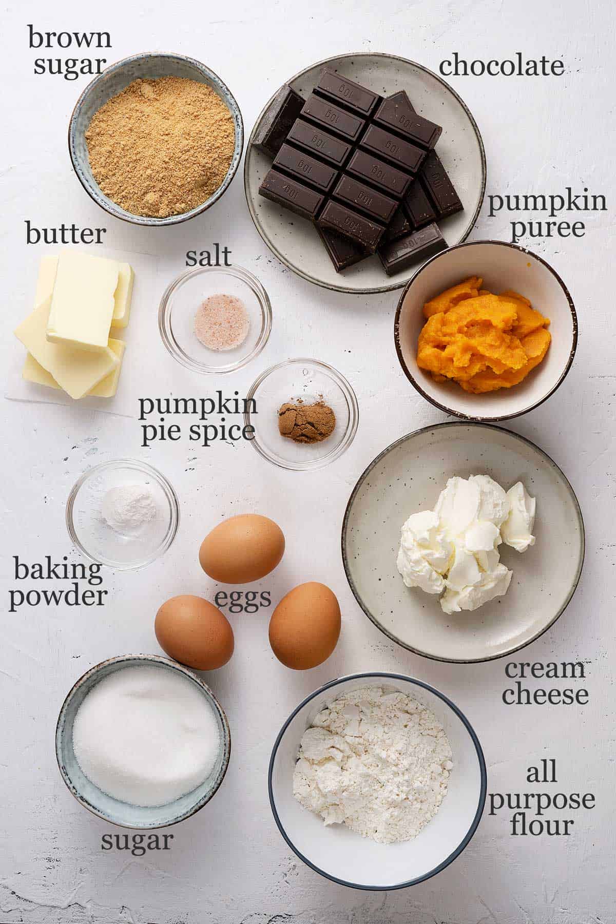 Ingredients to make pumpkin cheesecake brownies.