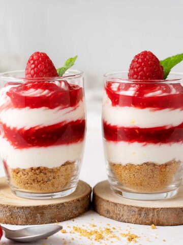 Two Raspberry Cheesecake Shots on the table