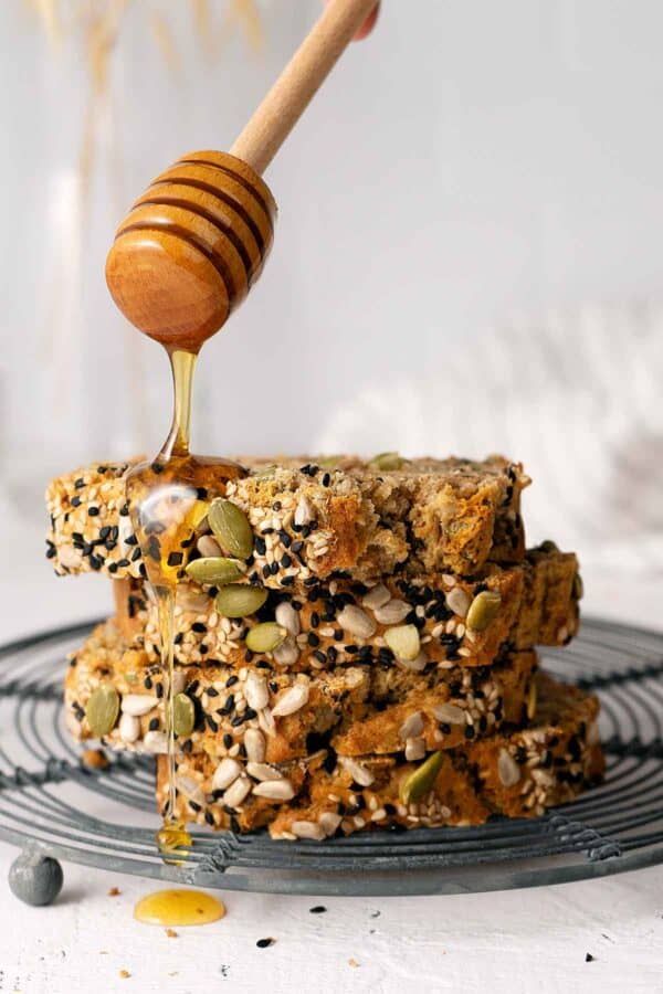 Slices of multi seed bread with honey.