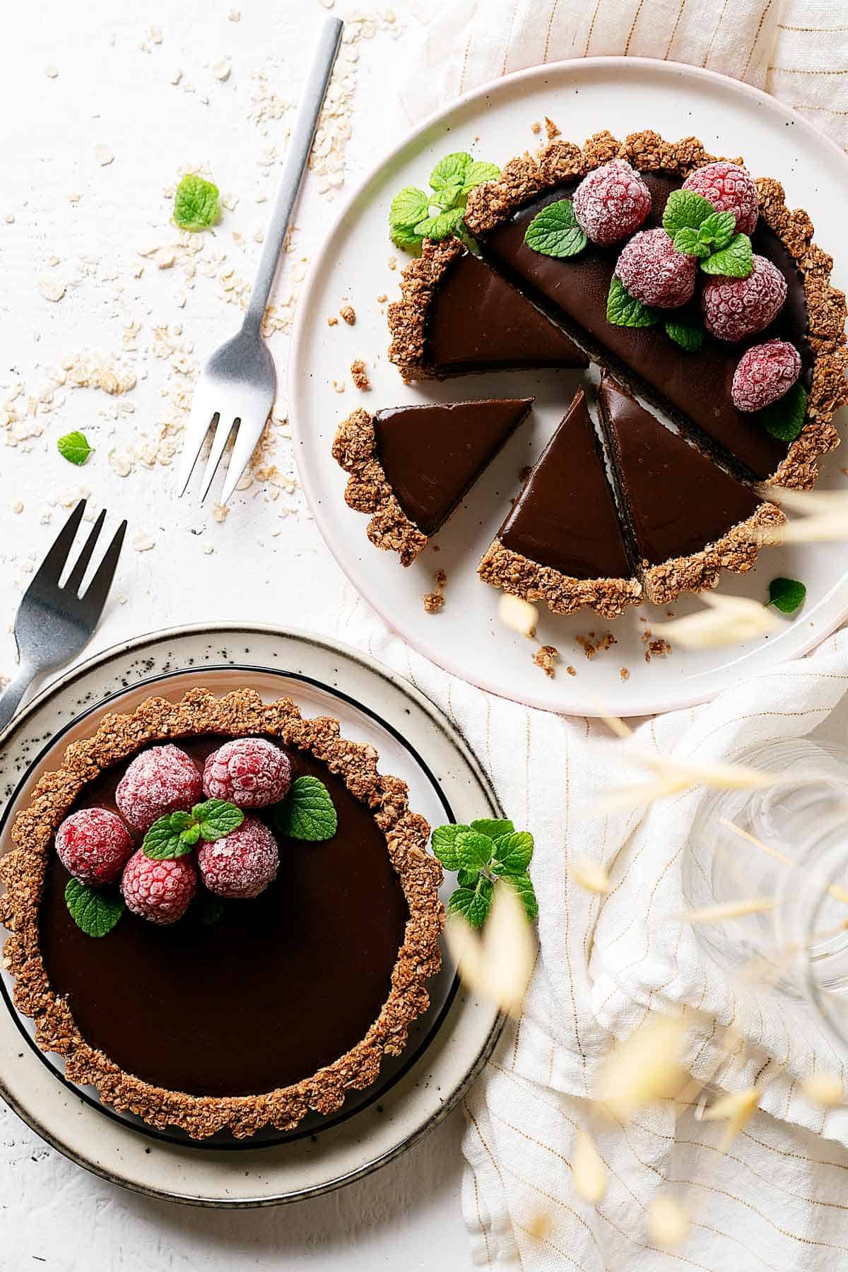 Healthy chocolate coconut tarts sliced view from top with 1 tart whole