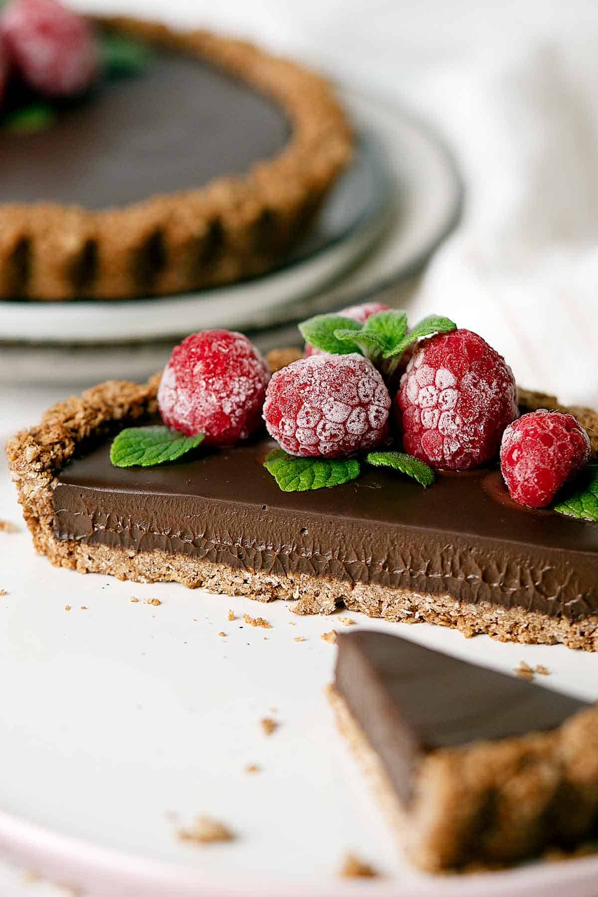 Showing the creamy filling of a sliced healthy chocolate coconut tarts