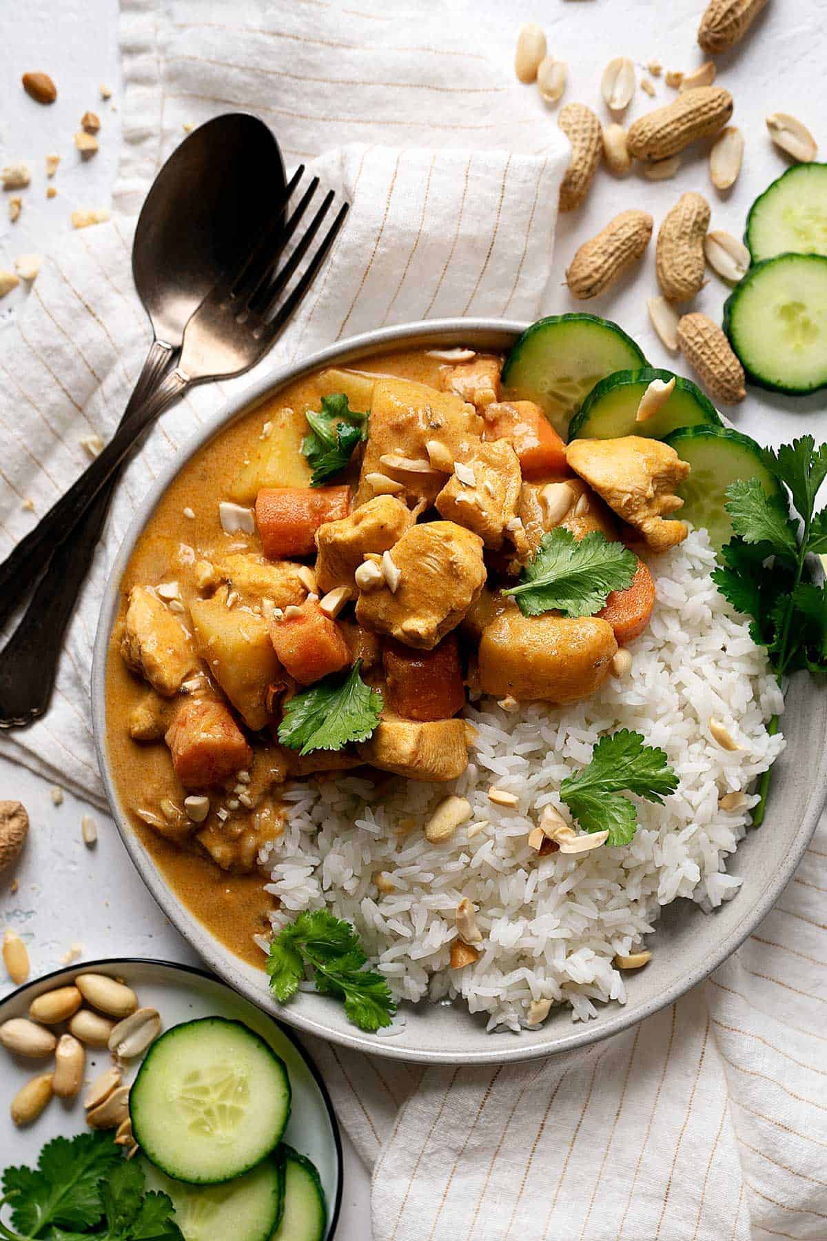 Quick chicken massaman curry in a plate with some rice.