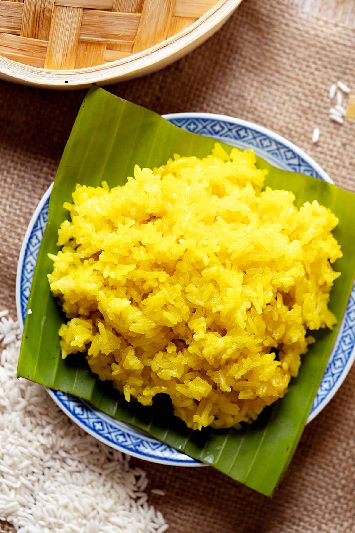Steamed glutinous rice with turmeric and coconut milk in a plate