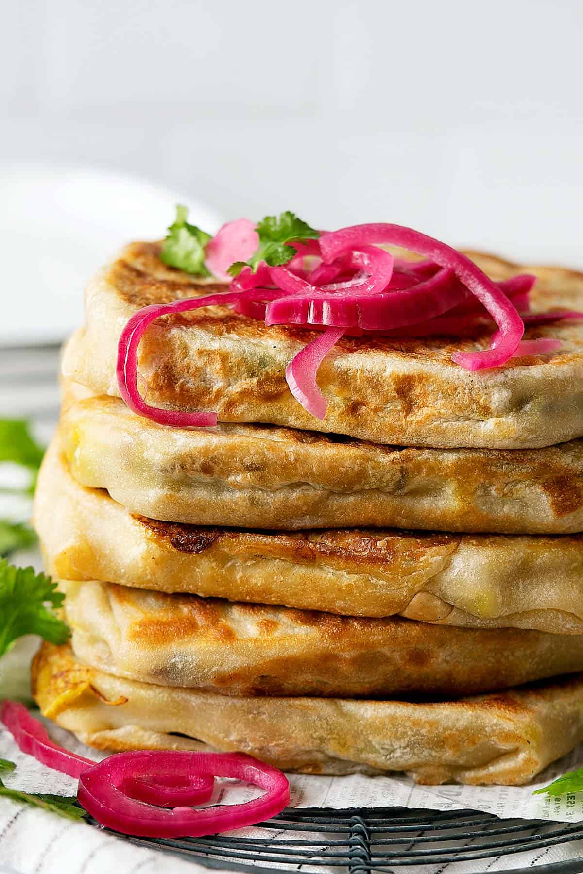 Whole chicken murtabak flatbreads stacked