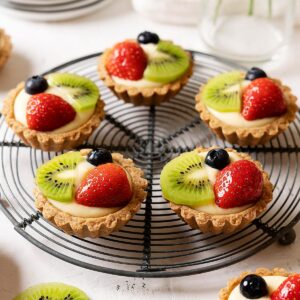 Healthier fruit tarts on a rack