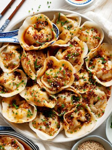 Wontons in garlic chili oil in a plate