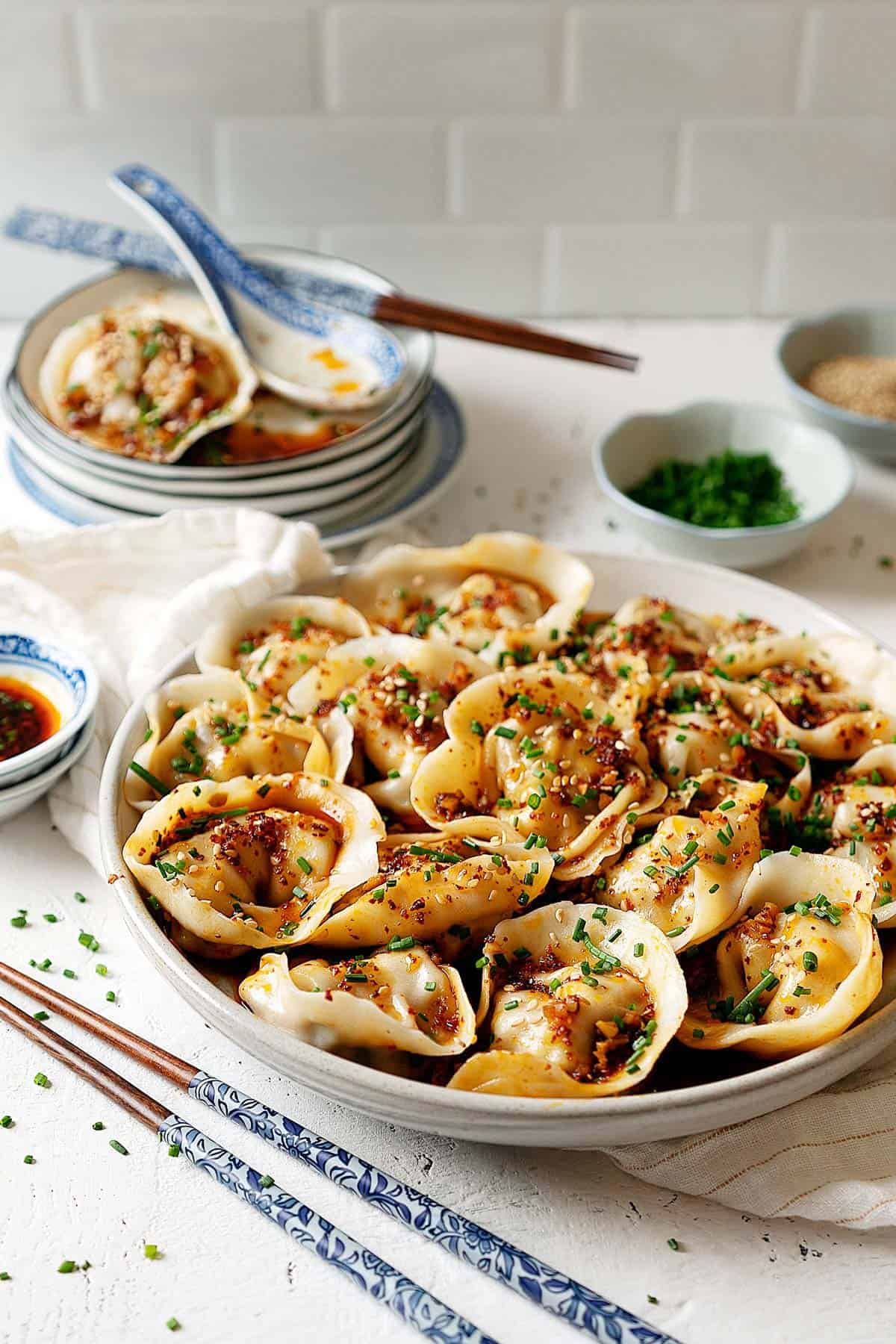 Wontons in garlic chili oil in a plate view from front