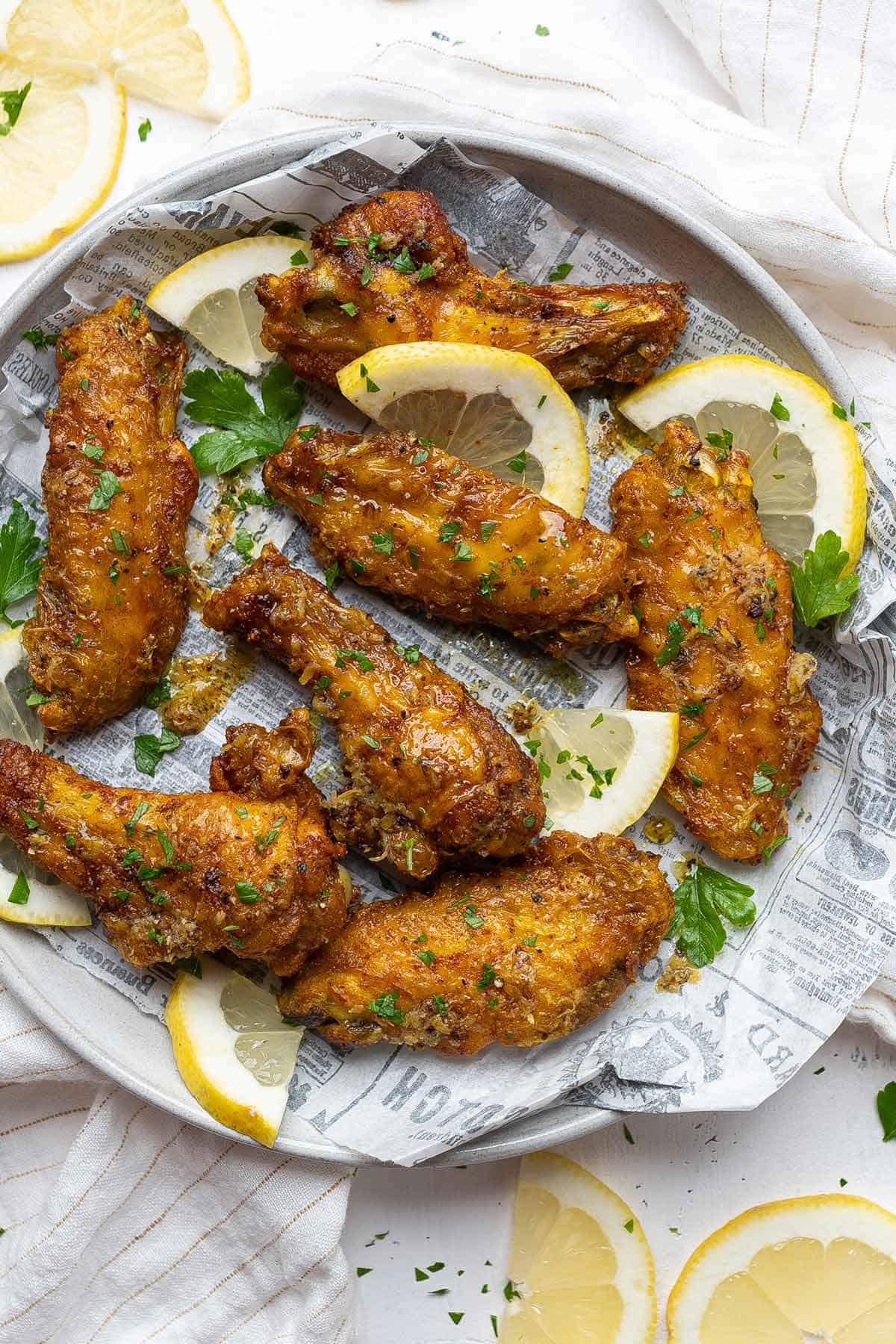 Crispy baked lemon pepper chicken wings in a plate