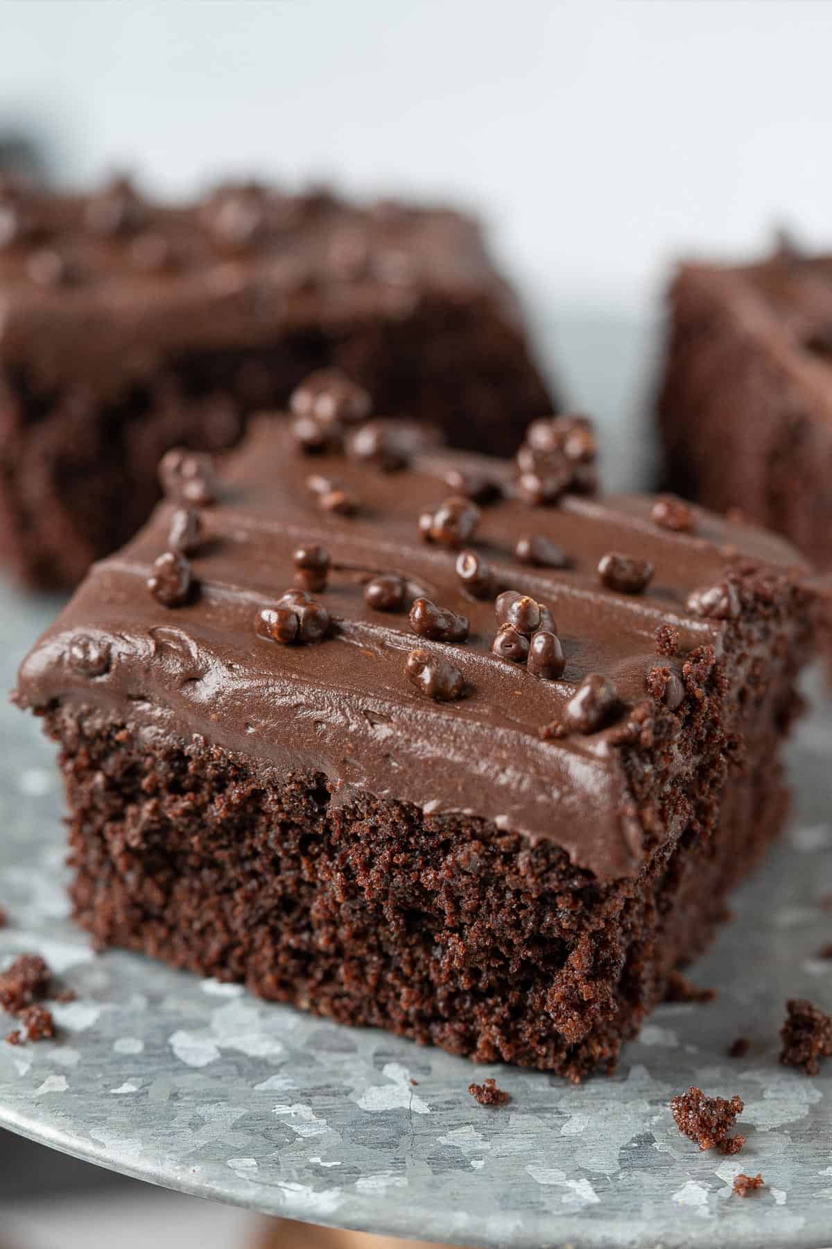 Healthy chocolate sheet cake on a cake stand