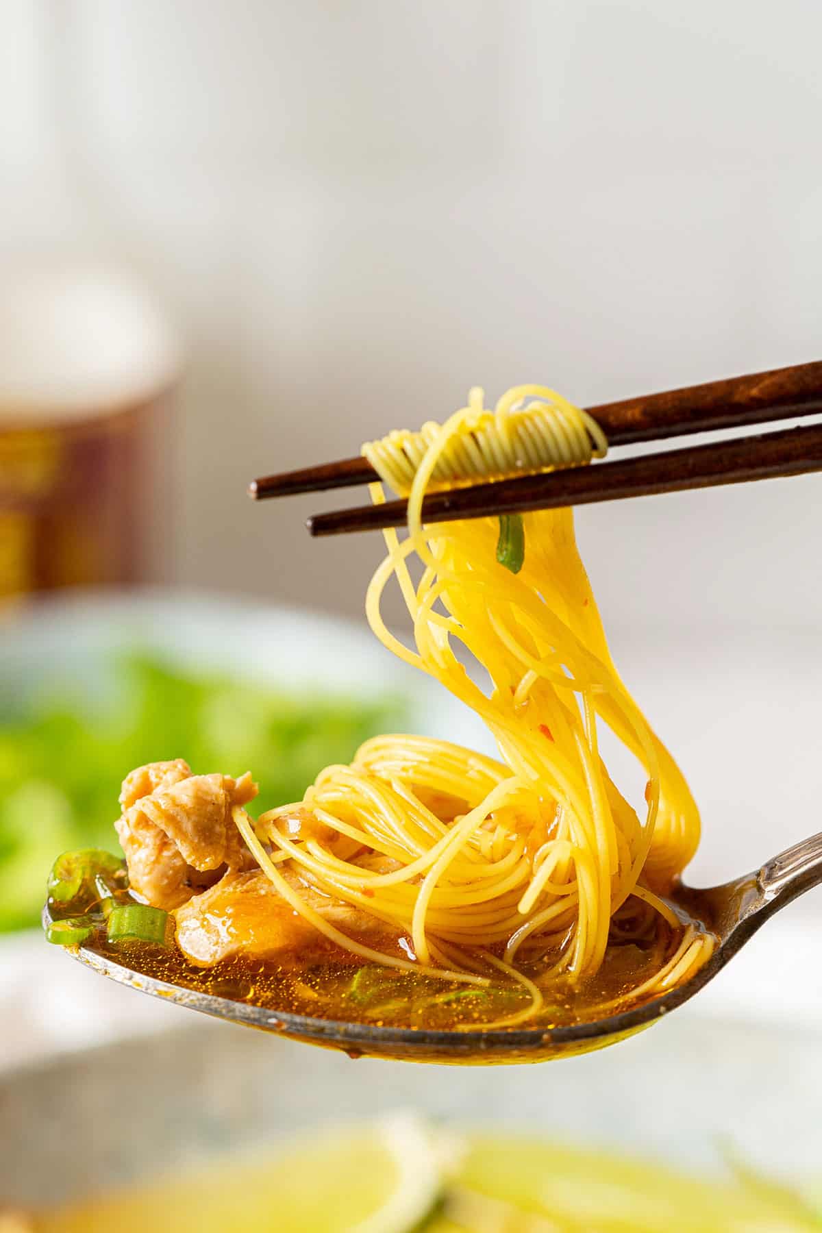 Eating some lemongrass ginger chicken soup with turmeric rice noodles