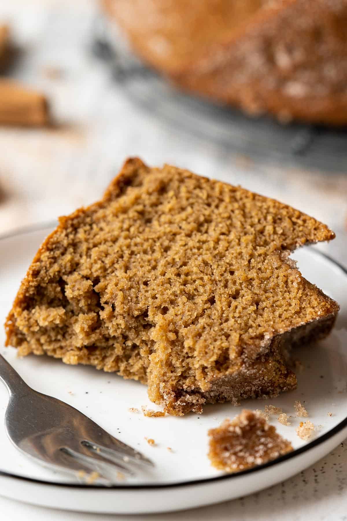 Half eaten healthy apple cider doughnut cake