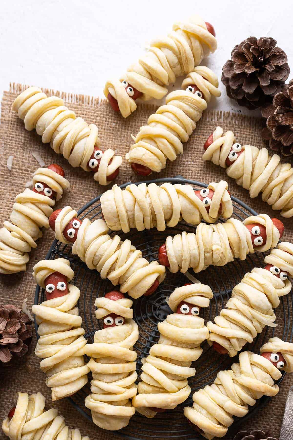 Hot dog mummies on a rack