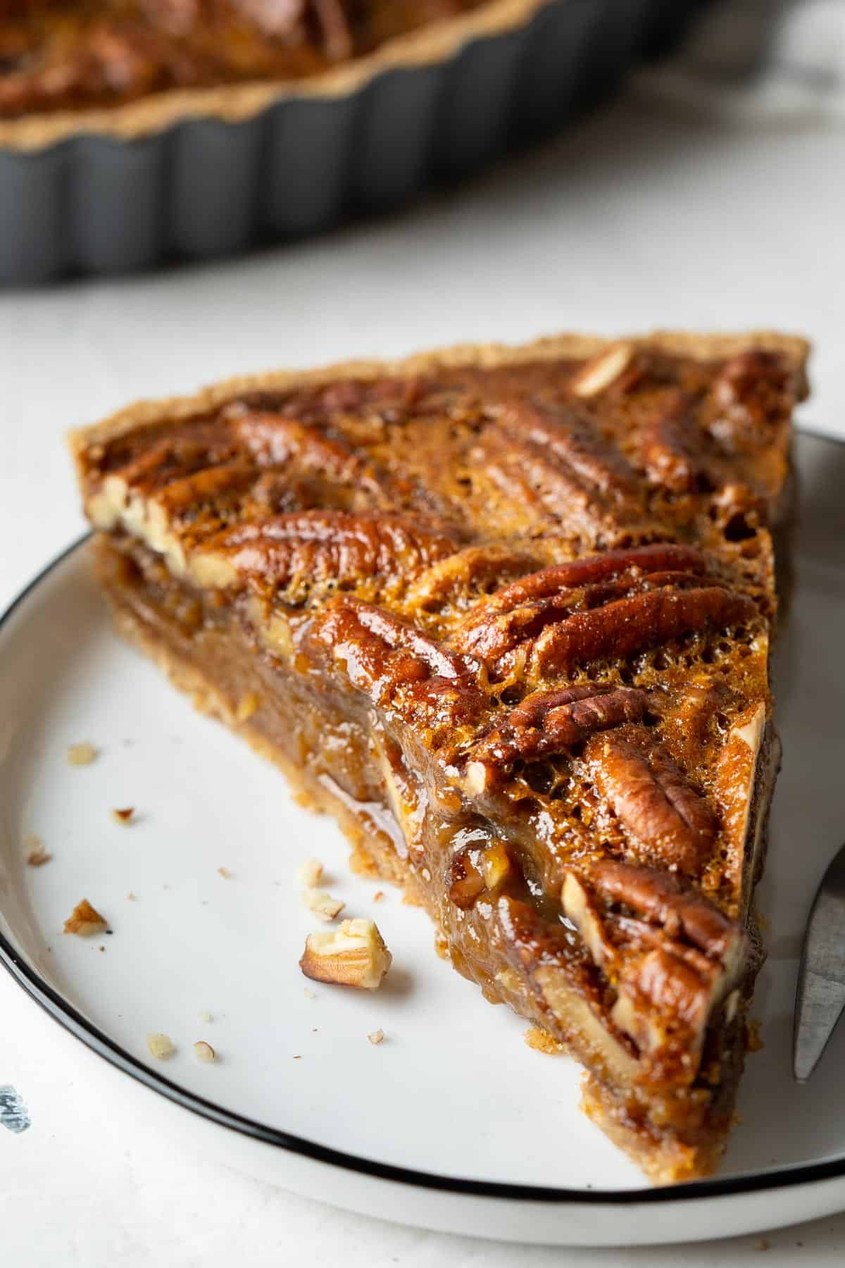 A slice of healthy pecan pie without corn syrup
