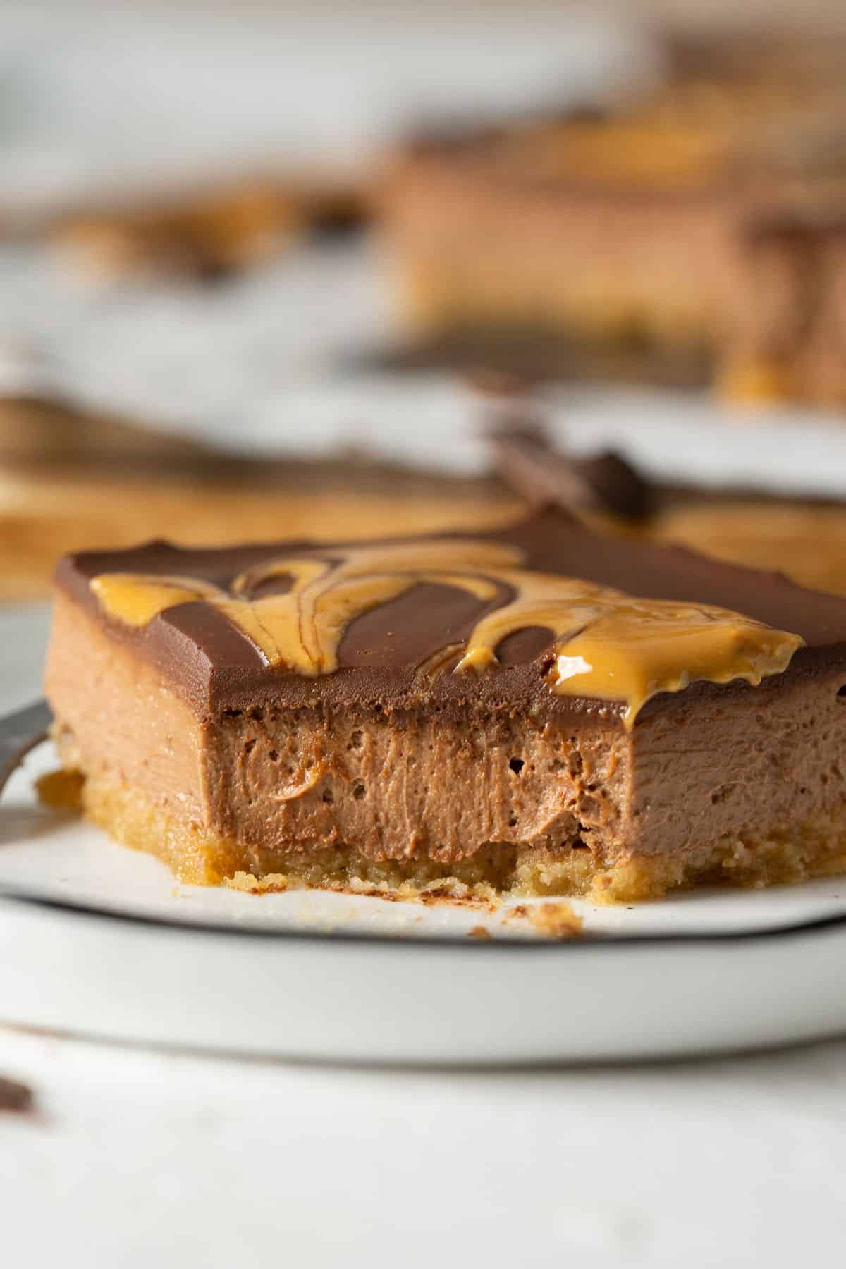 Showing texture of half eaten healthy chocolate cheesecake bar