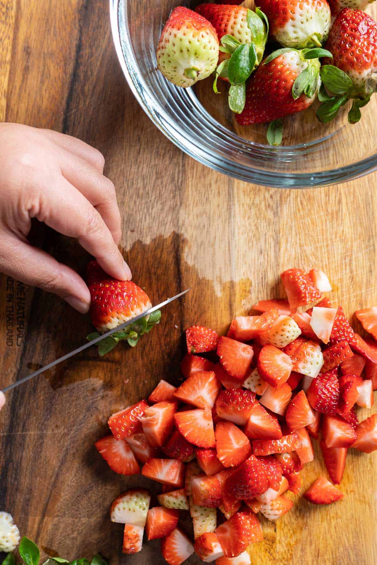 Cutting strawberries to make healthy strawberry oatmeal bars