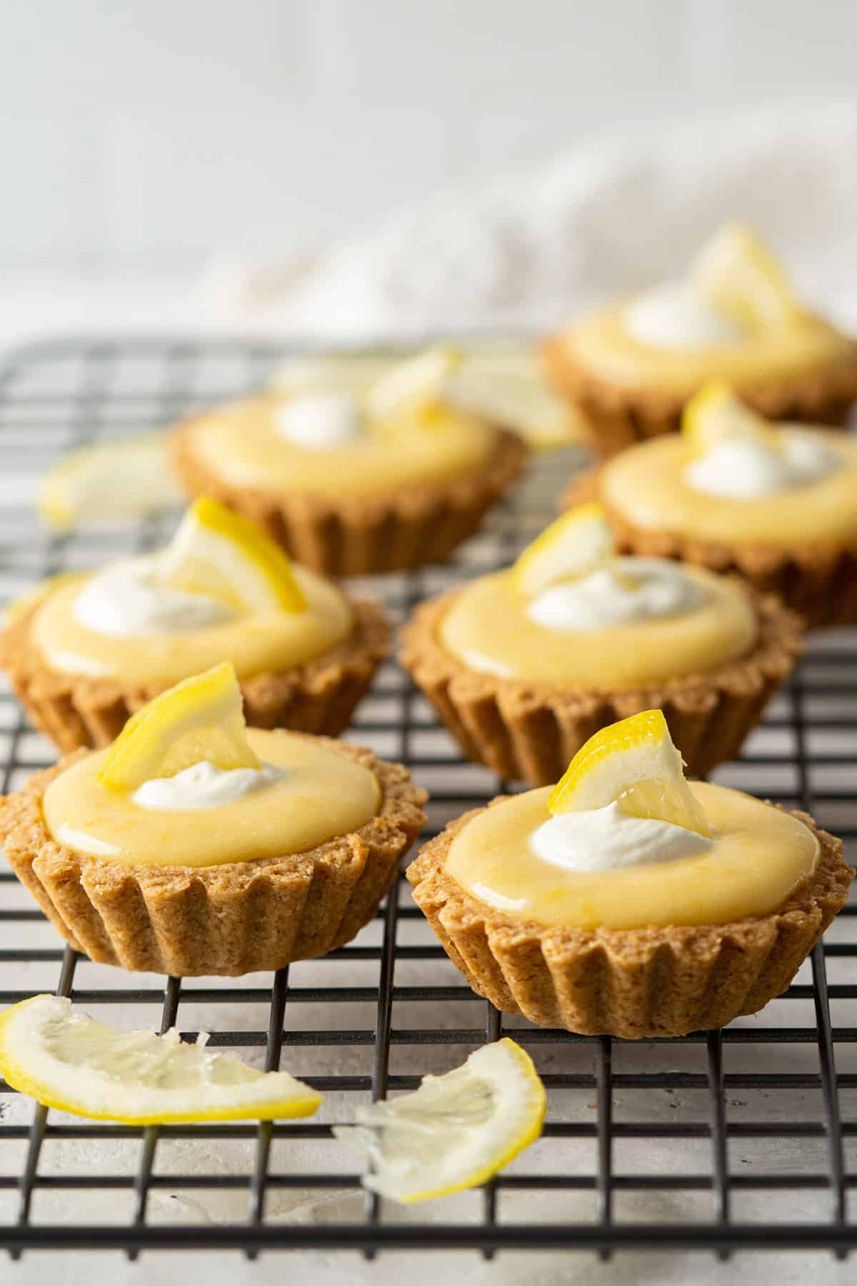 Healthy lemon tarts on a rack view from front