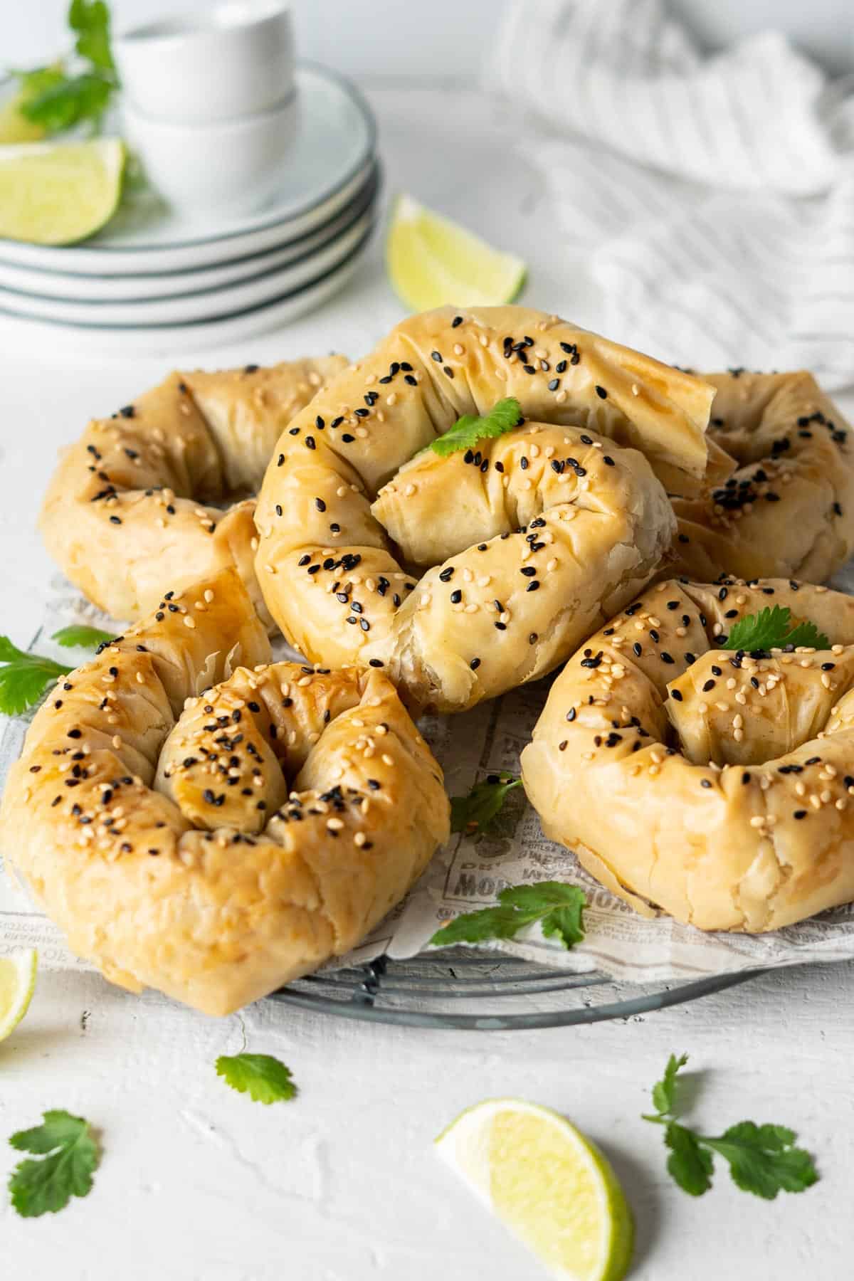 Baked potato phyllo samosa coils on a rack.