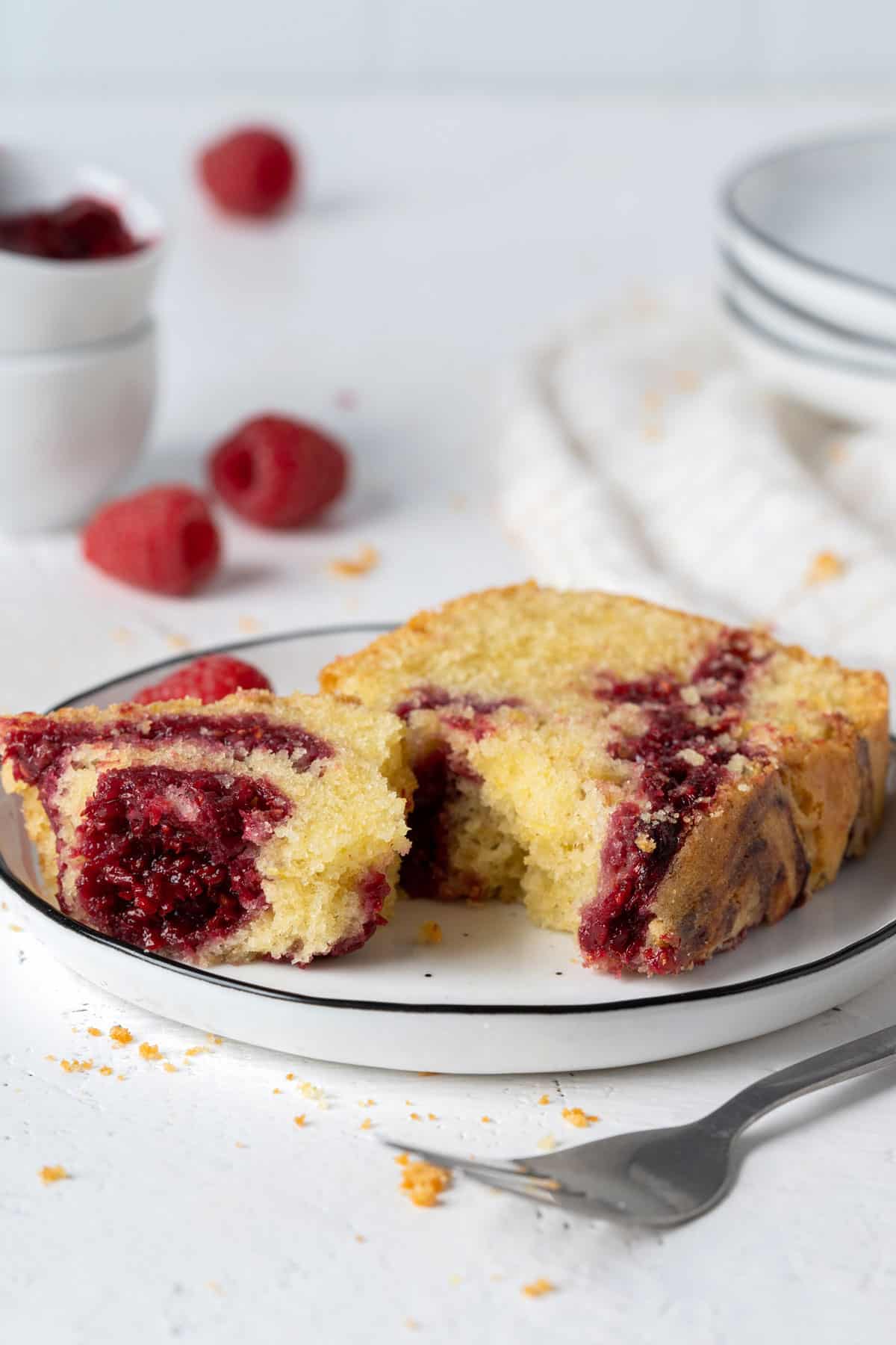 Half eaten healthy olive oil raspberry swirl cake